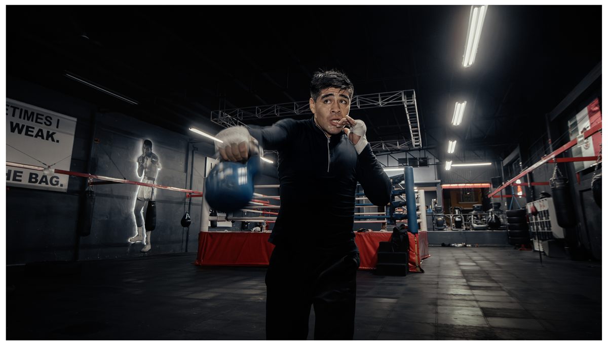 Boxer doing conditioning drills with gloves
